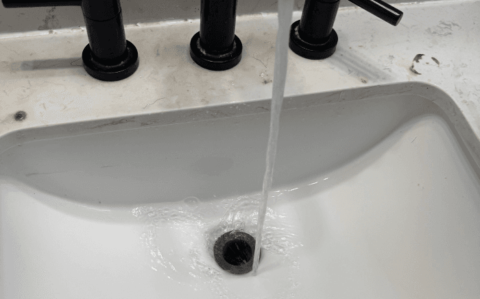 Clean sink water flow after Mor Handy plumbing repair