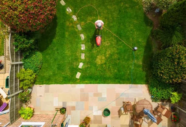 Mor Handy landscaping service trimming a Maryland residential yard