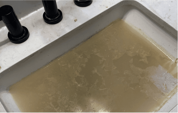 Cloudy clogged sink water before drain repair Cloudy clogged sink water before drain repair